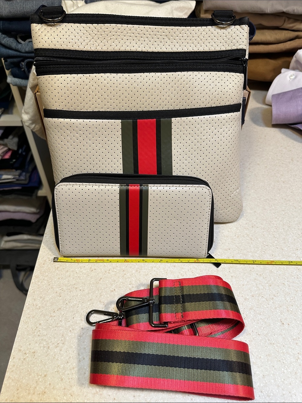 Haute Shore: Beige Perforated Crossbody Bag with Red & Green Stripe with wallet